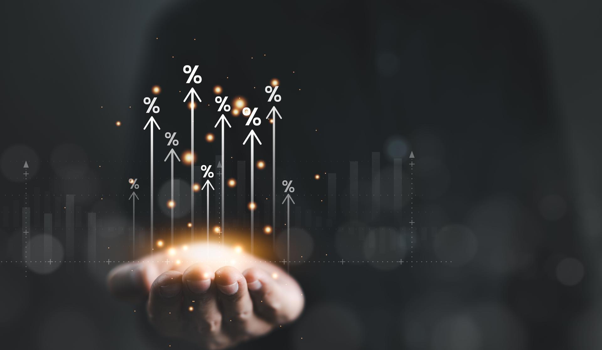 Interest rate and dividend concept. Businessman hand with rising arrow and percentage icon. Business finance and money concept, Investment growth, Return on stocks and mutual funds, profitability,